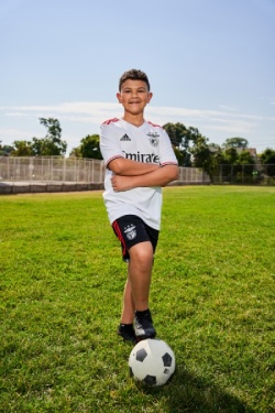 Justin posing with a soccer ball