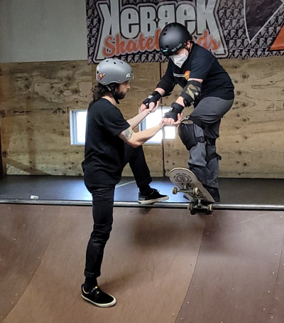 Ollie on his skateboard