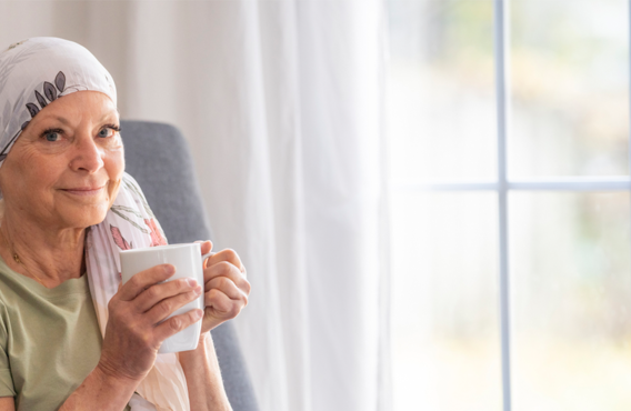 Woman with Chronic myelomonocytic leukemia holding a tea cup