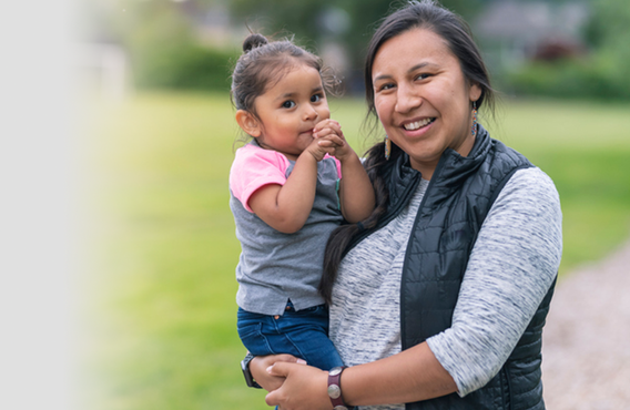 Indiginous woman holding her child