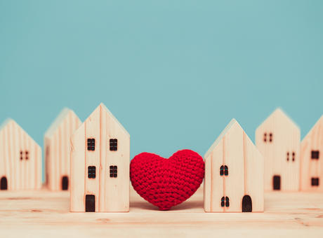 A wooden miniature town with a heart in the middle