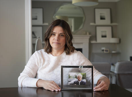 Laura Martire with a photo of her father.