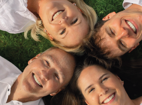 A ground shot of Shawn Omstead and 3 family members smiling