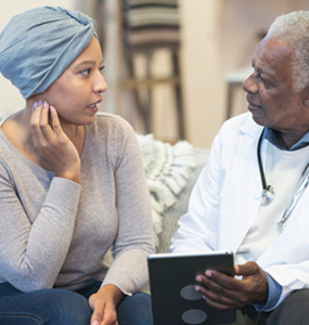 Woman with cancer and Doctor 