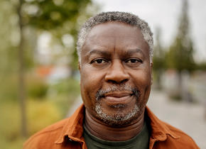 An old man smirking