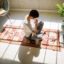Person meditating in bright room