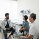 Doctor meeting with an older man and woman